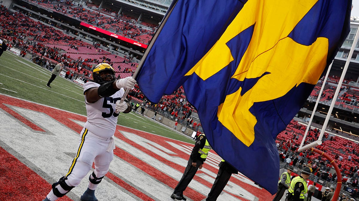 Trente Jones waves the flag