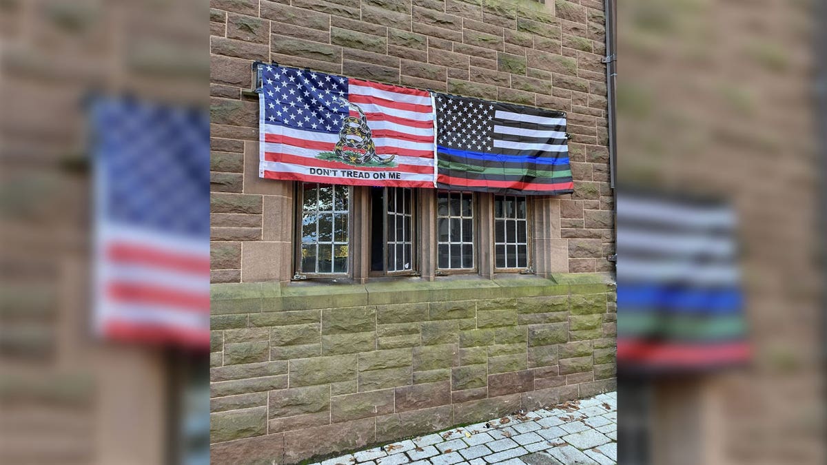 Two flags outside the students' dorm room