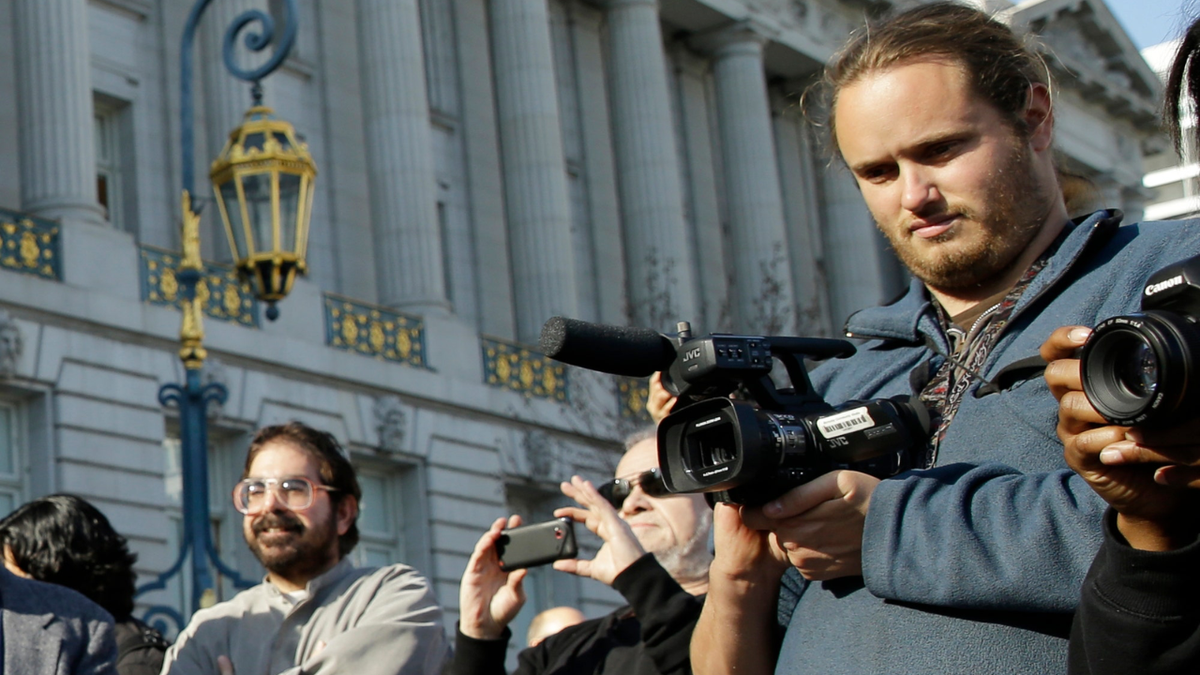 David DePape holding video camera