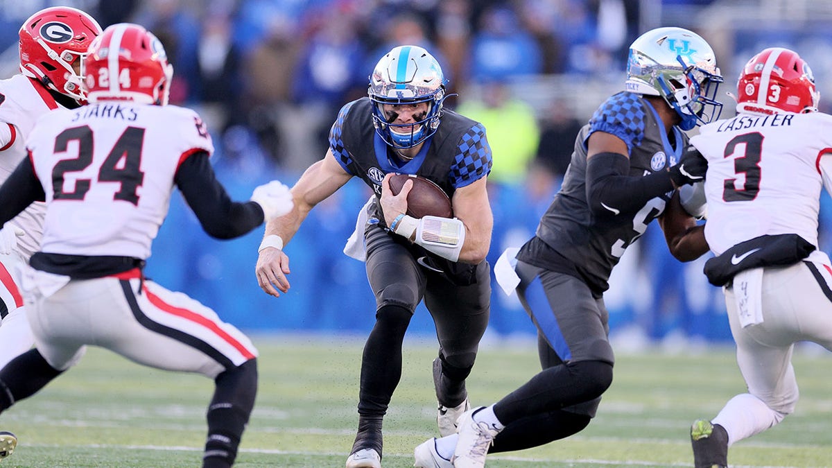 Will Levis carries the football