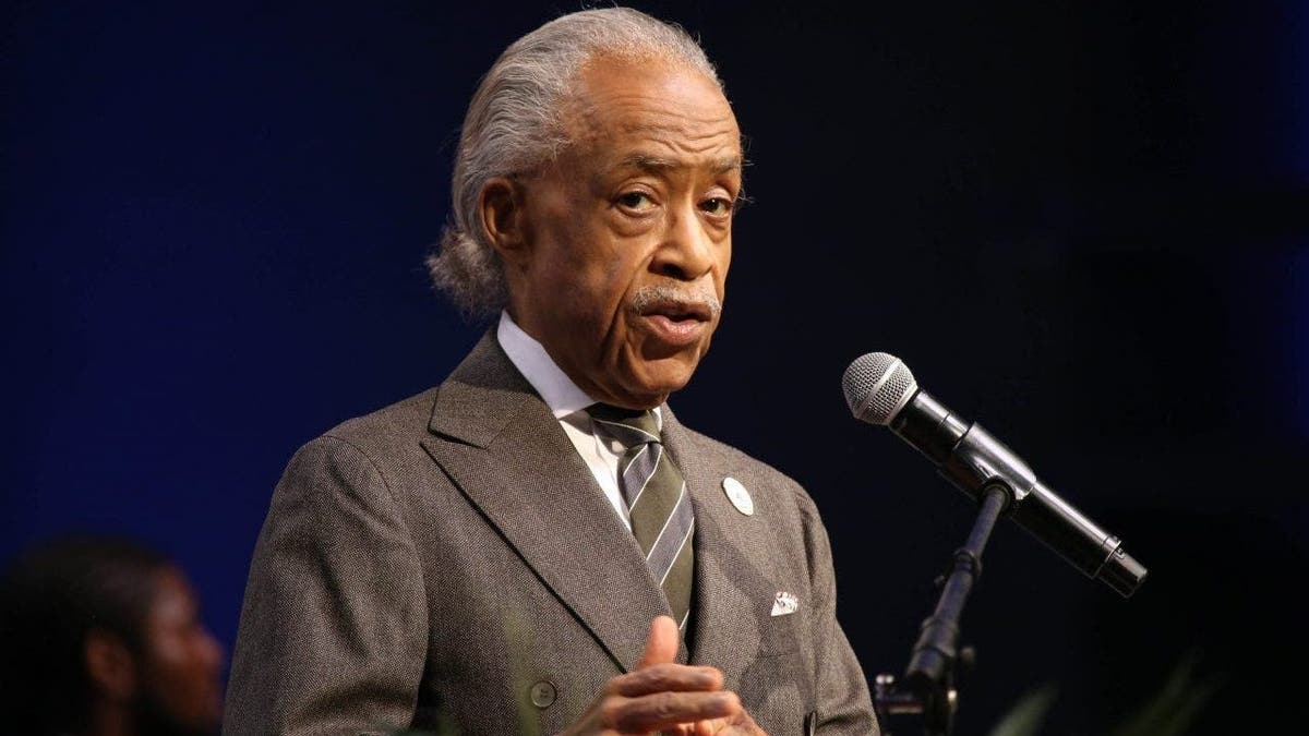 Al Sharpton speaking at podium