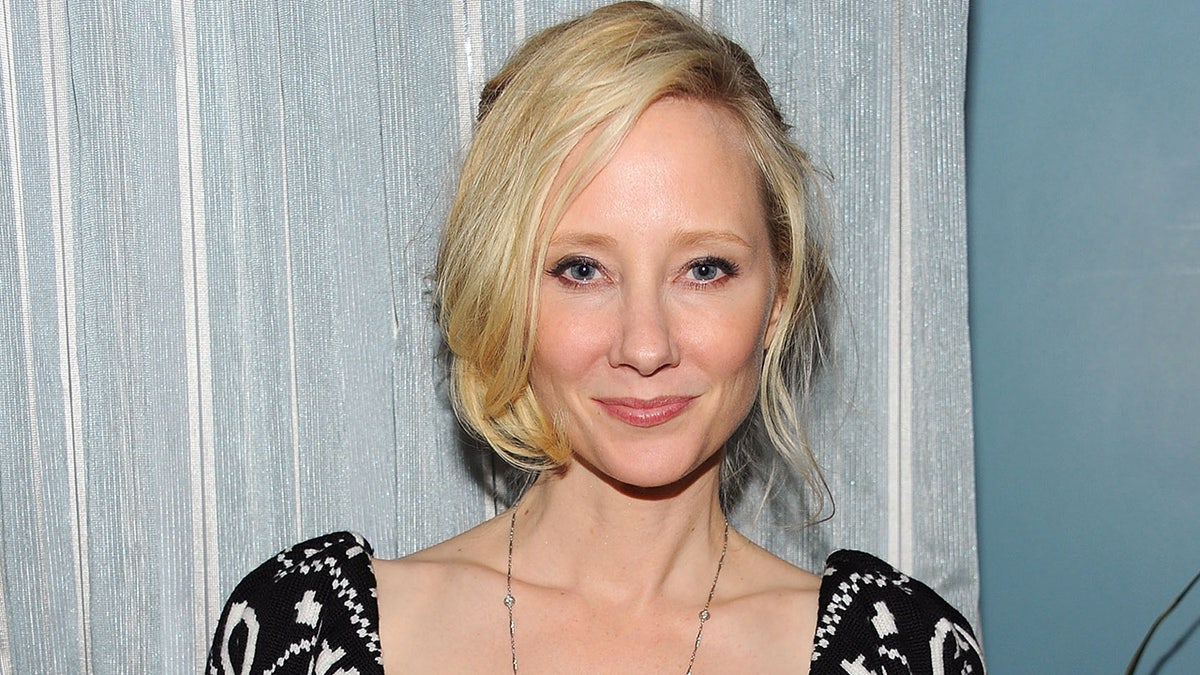 Anne Heche poses on red carpet at movie premiere