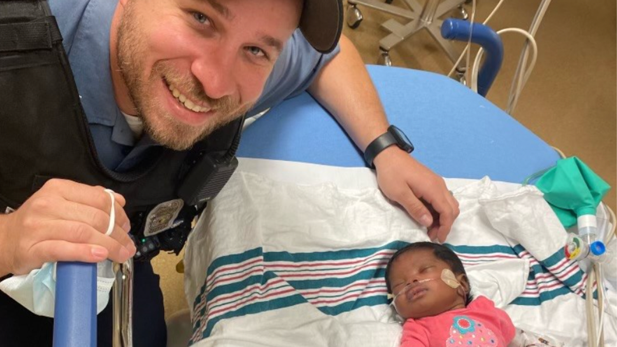 Kansas City Police officer with baby