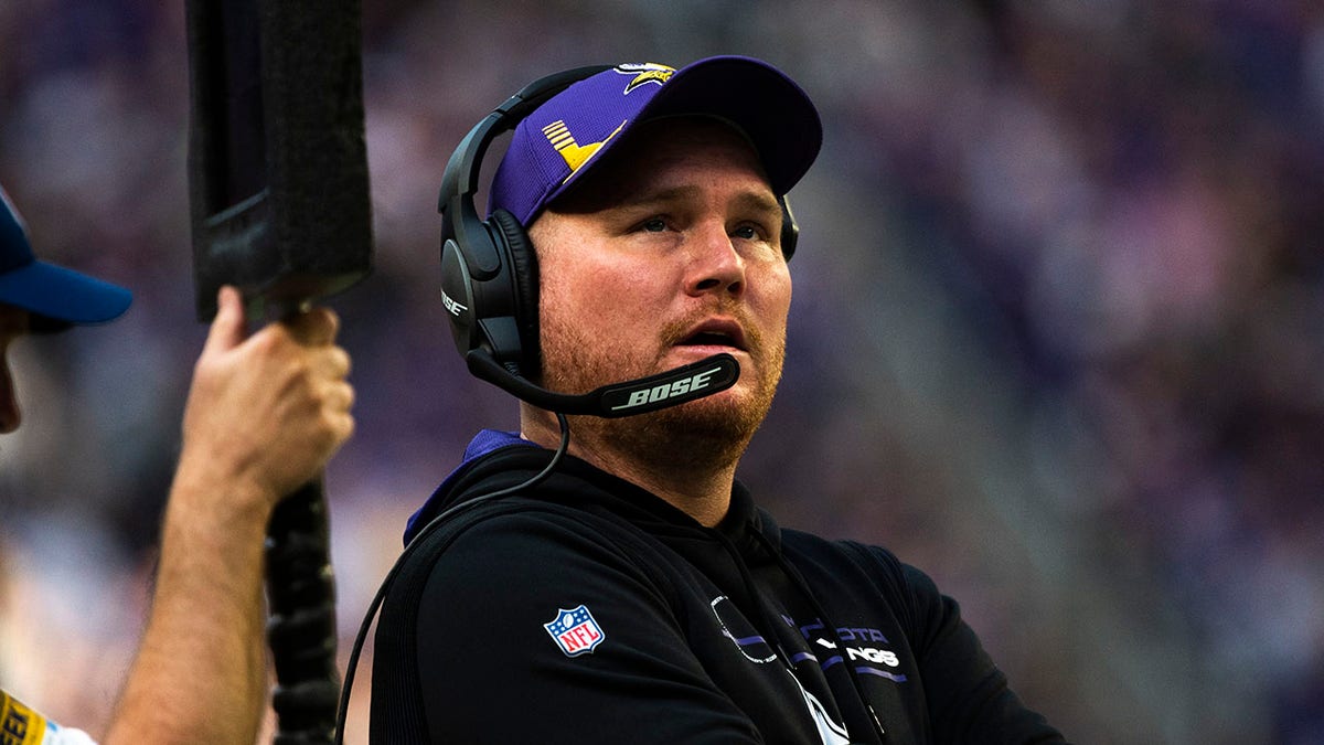 Adam Zimmer stands on the sidelines