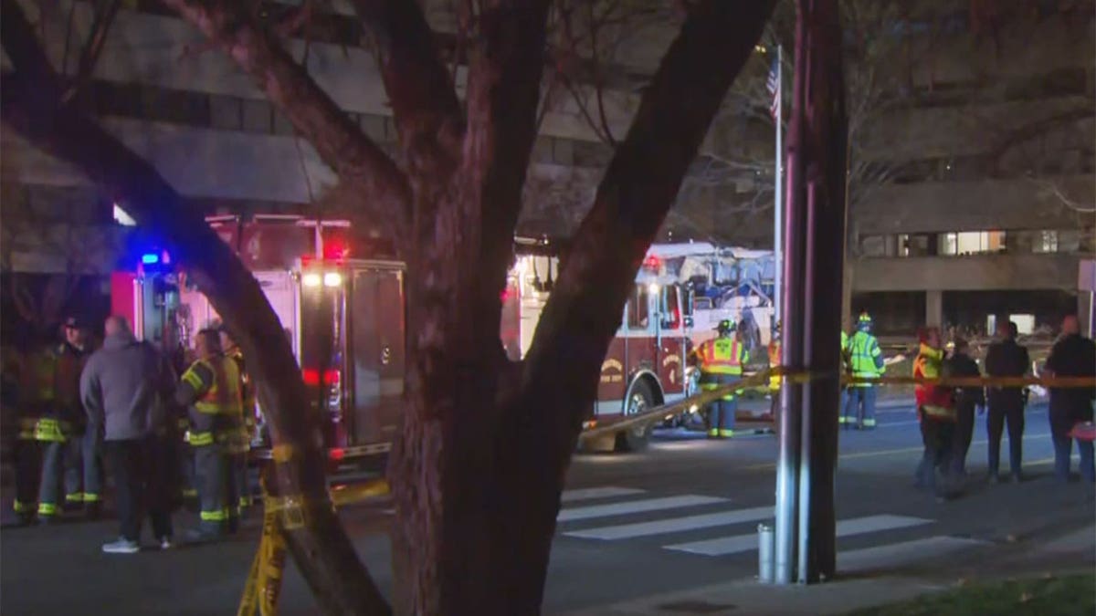 Flashing patrol car lights and a fire truck at night 