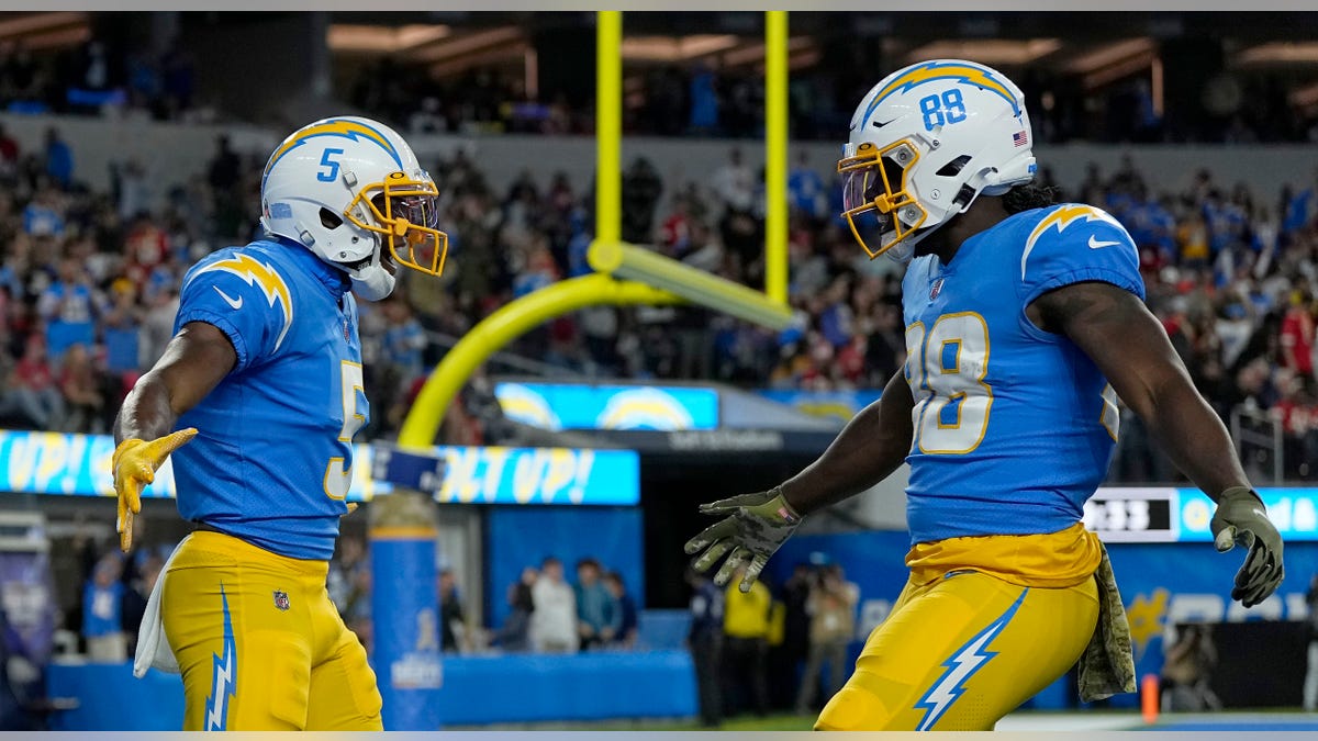 Josh Palmer high-fives Donald Parham Jr.