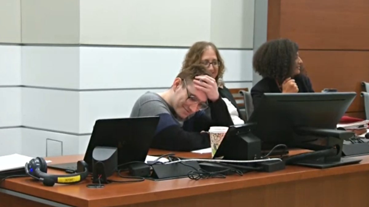 Cruz and Tamara Curtis laugh in court