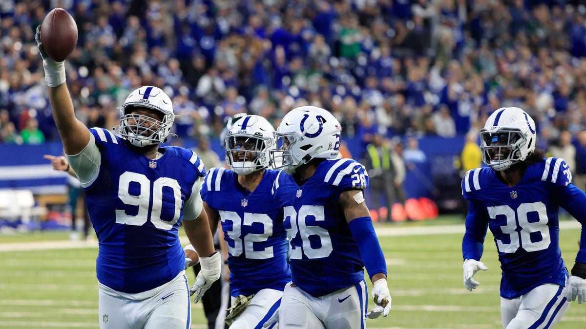 Colts defense celebrates fumble recovery