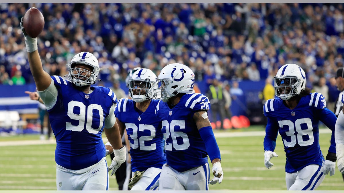 Colts defense celebrates fumble recovery