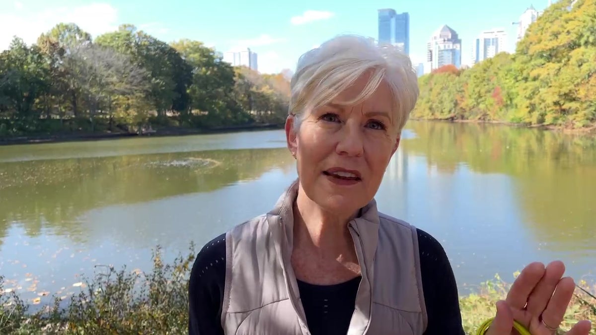 Ellen interviews in front of a lake in Atlanta