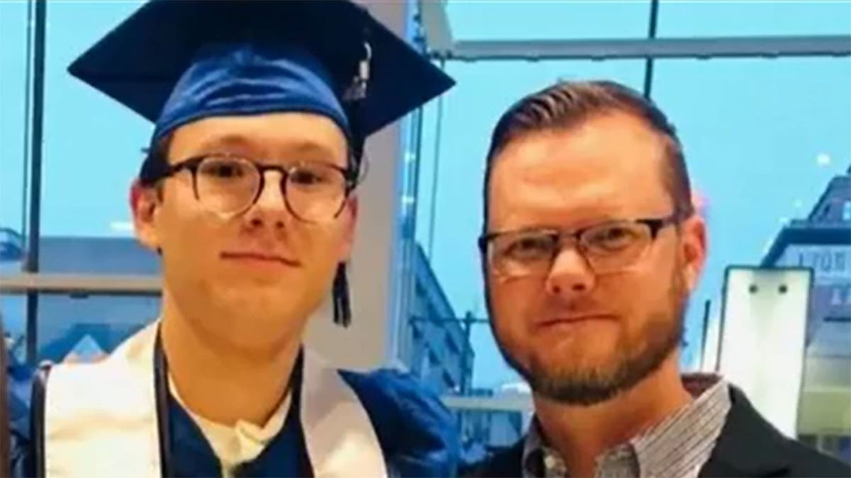 ethan williams and dad at graduation
