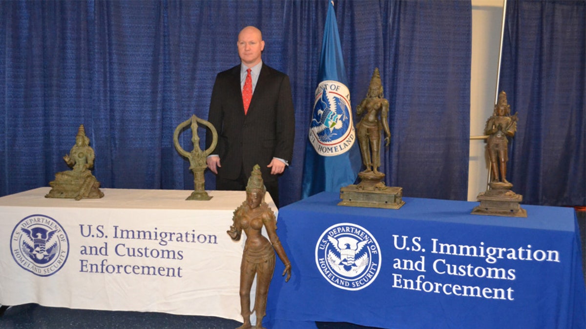 Homeland Security Investigations with seized artifacts