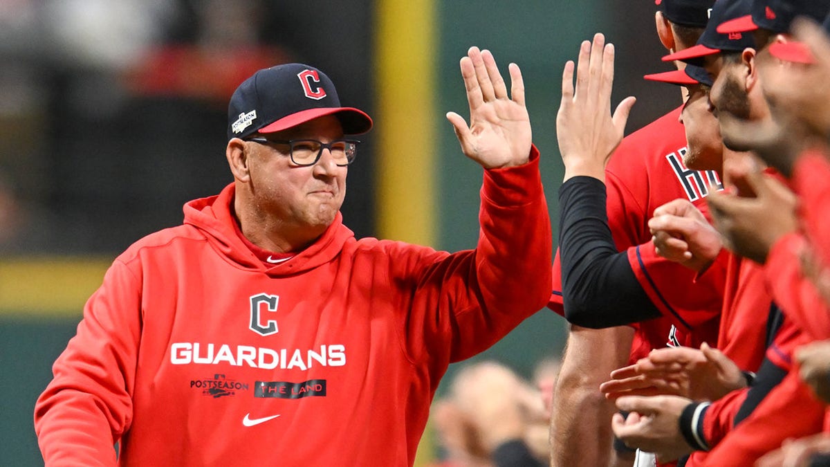 Terry Francona high-fiving Guardians