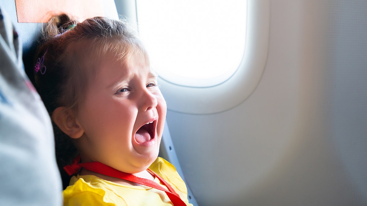 little girl screaming on airplane