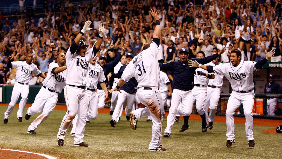 Jonny Gomes celebrates with Rays