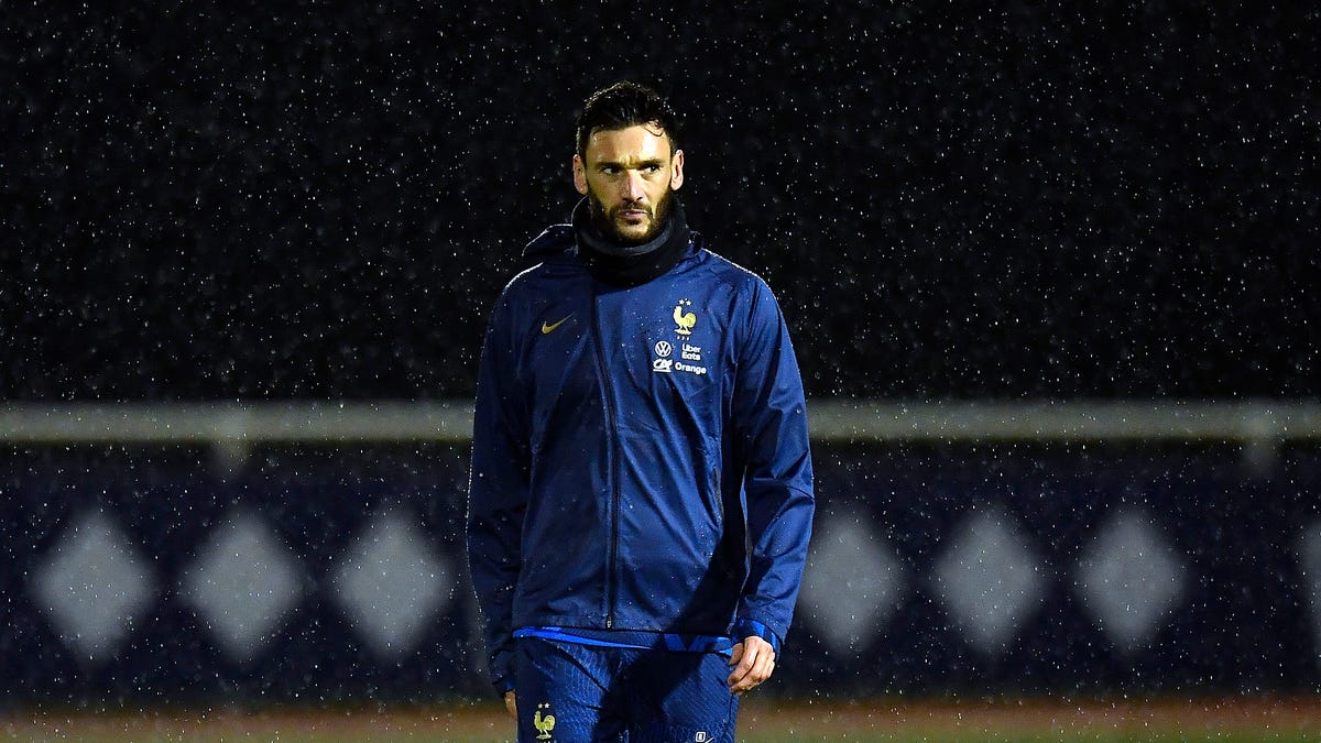 Hugo Lloris walks through rain