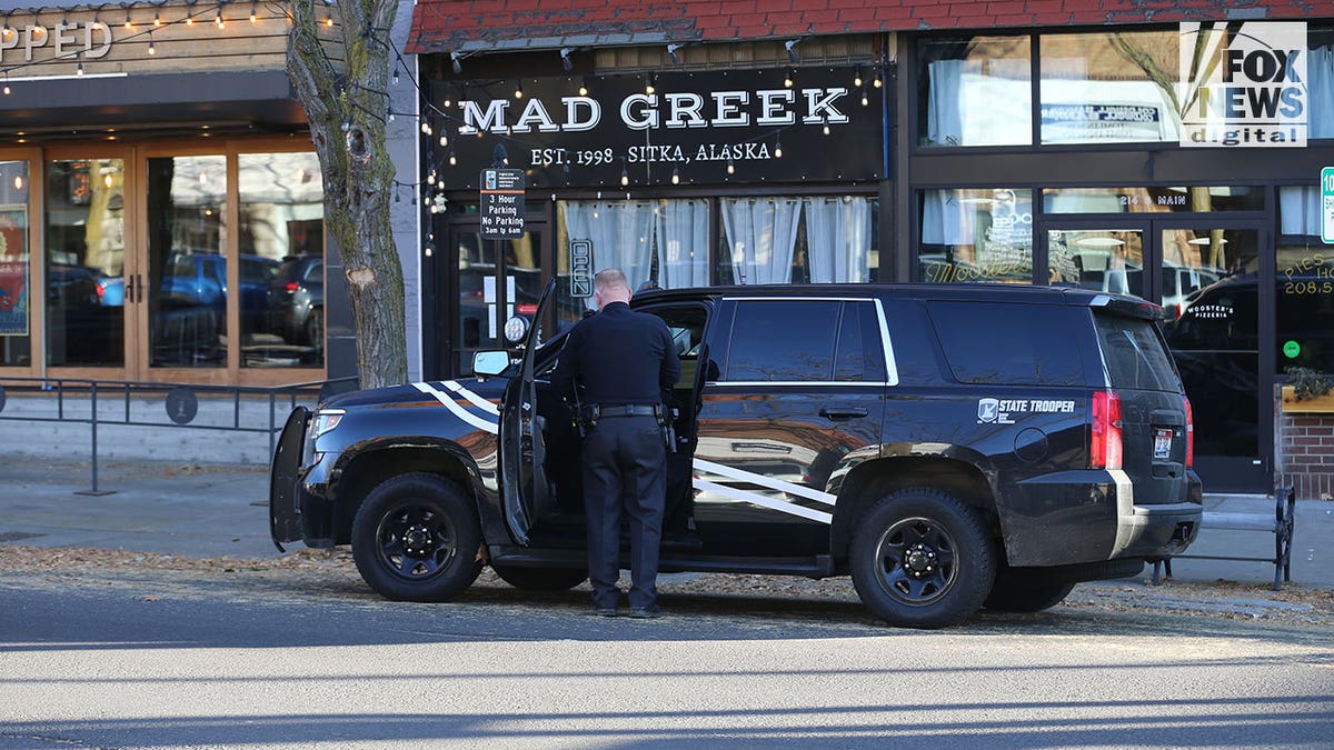 Patrol car parked outside Mad Greek Restaurant following University of Idaho murders