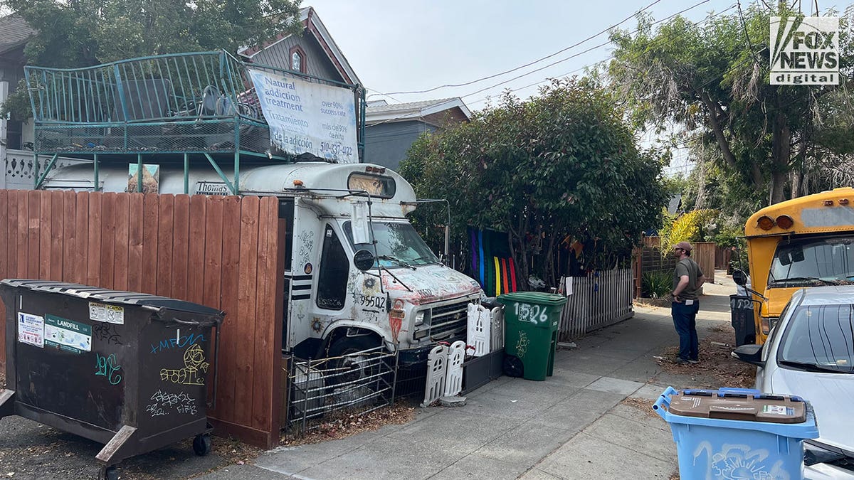 Views of a home in Oakland, with an old school bus in front