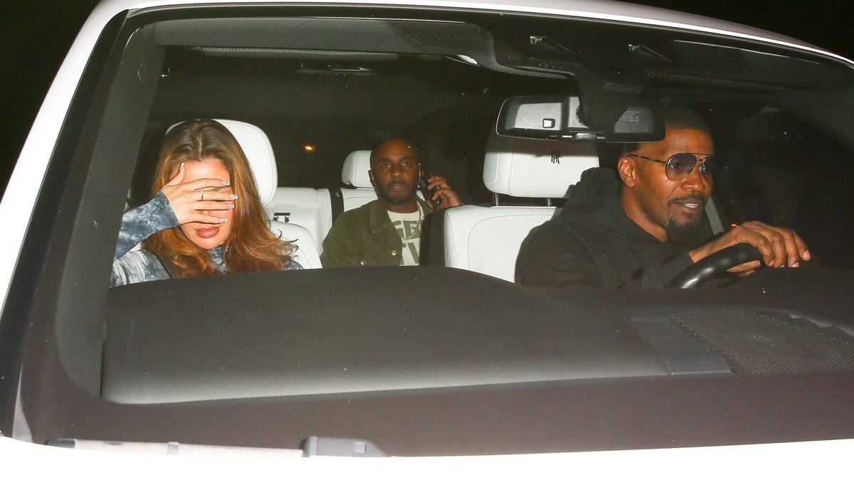 Jamie Foxx drives his Rolls Royce with other people in the car