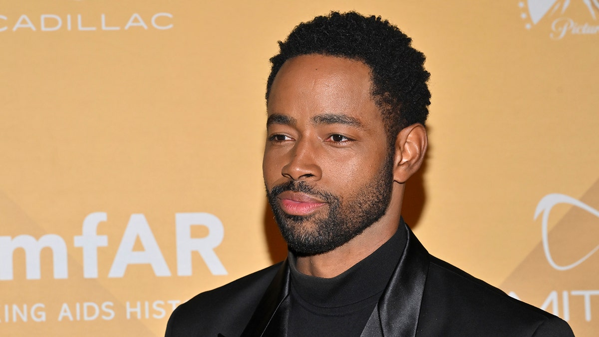 Jay Ellis on red carpet for amFAR Gala