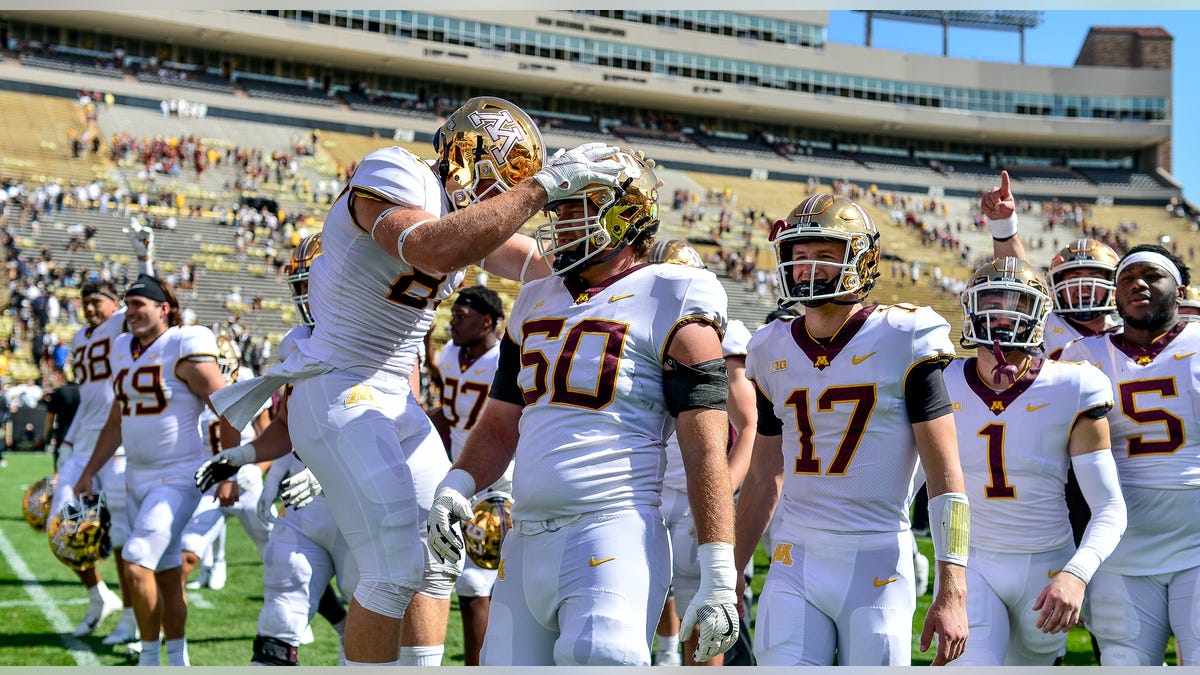 John Michael Schmitz celebrates