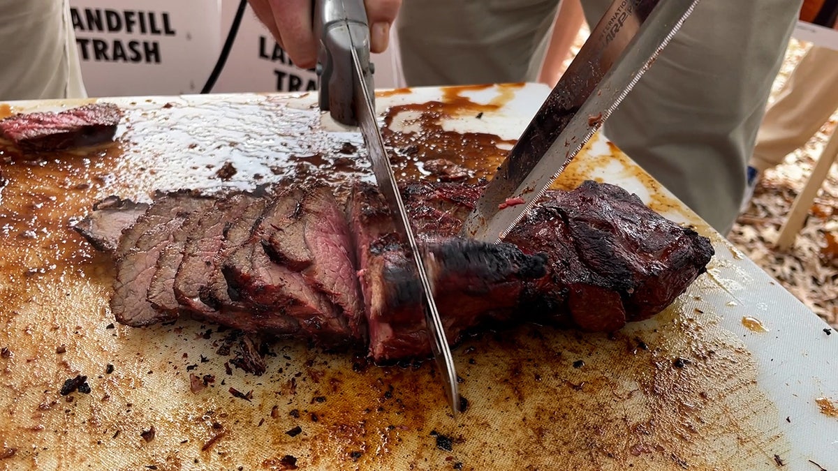 A man slices a London Broil