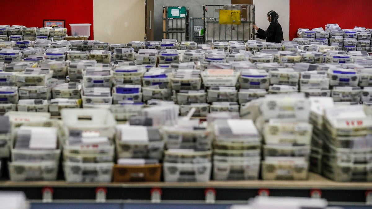 Los Angeles election officials sort ballots.