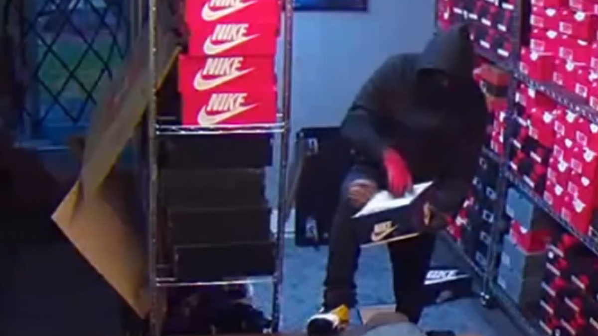 Thief going through a shoe box at a store in Texas 