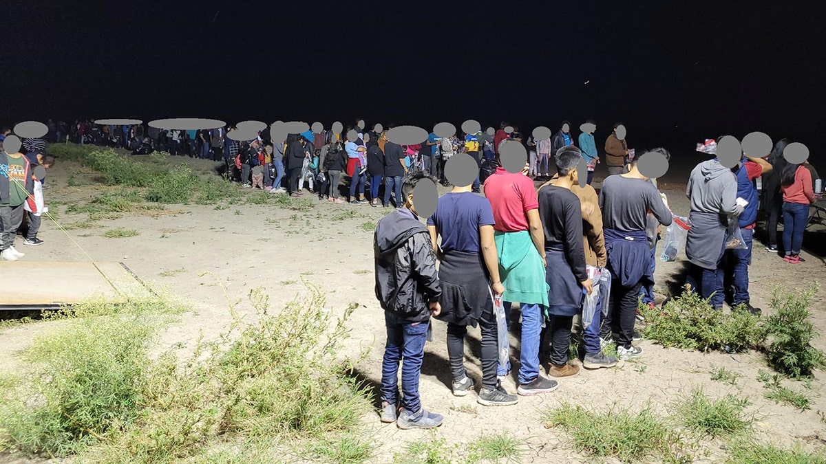 illegal immigrants in line