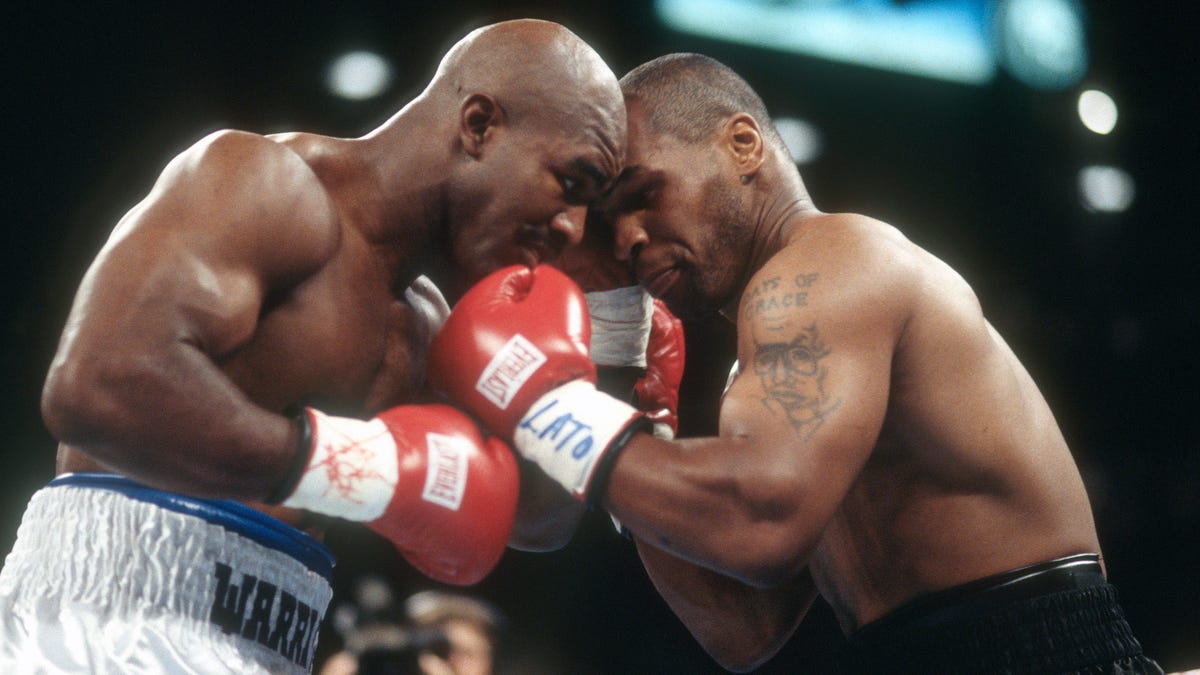 Evander Holyfield and Mike Tyson fighting