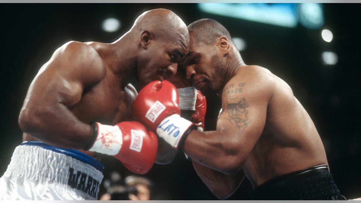 Evander Holyfield and Mike Tyson fighting