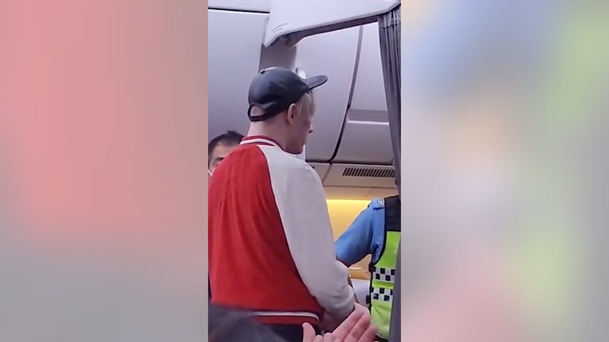 Passenger escorted off of plane after tantrum