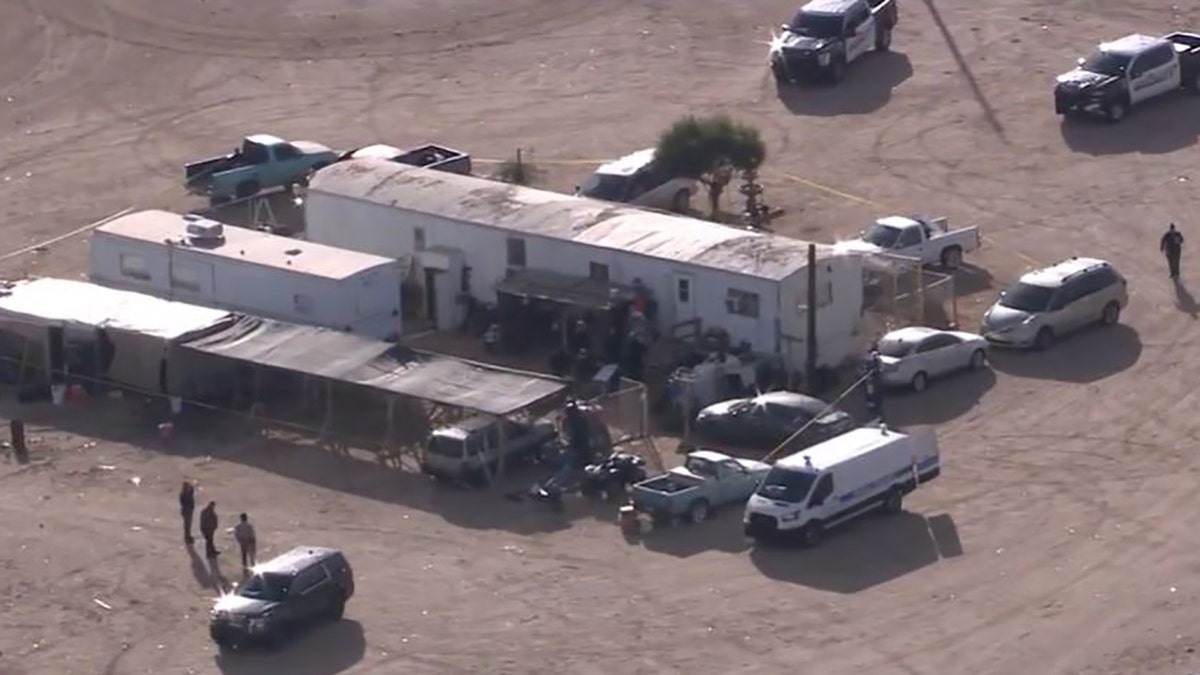 aerial of home with police on scene