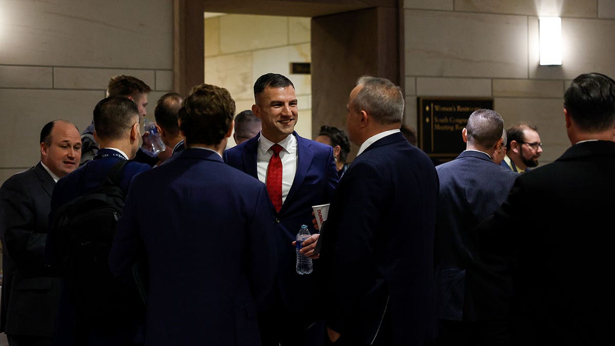 Rudy Yakym smiles and greets lawmakers during orientation