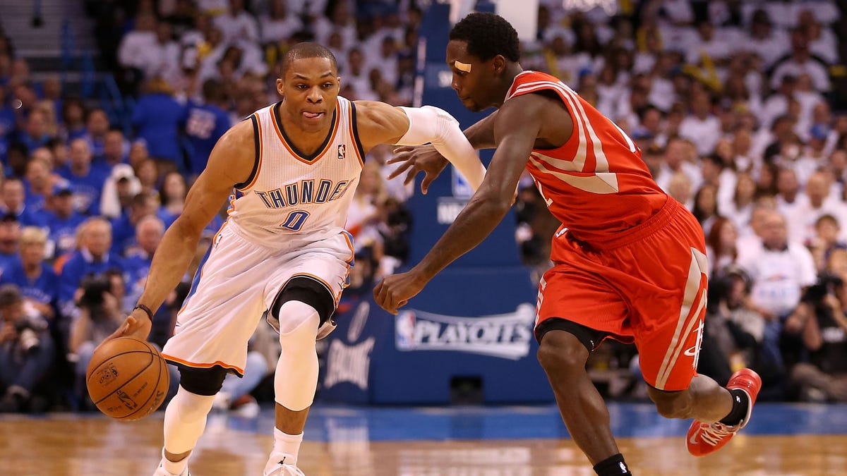 Russell Westbrook dribbles