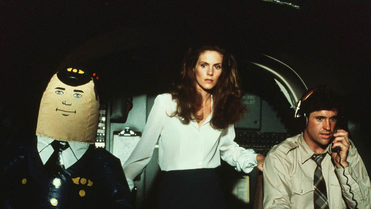 Airplane cockpit scene with a woman in the middle