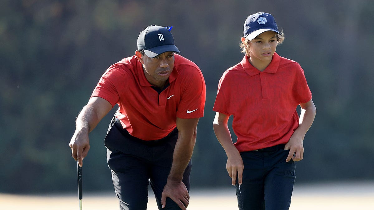 Tiger and Charlie Woods on green