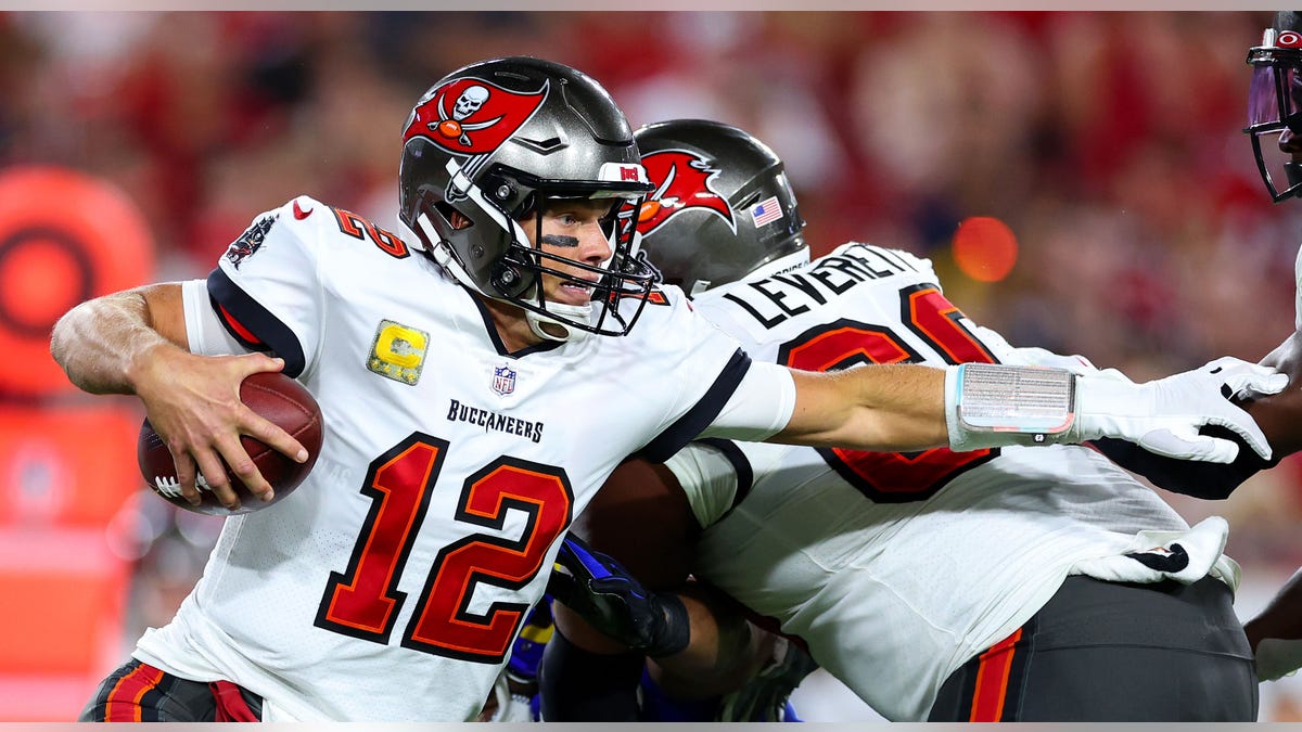 Tom Brady #12 of the Tampa Bay Buccaneers scrambles during the third quarter of a game against the Los Angeles Rams in the third quarter at Raymond James Stadium on November 06, 2022 in Tampa, Florida.