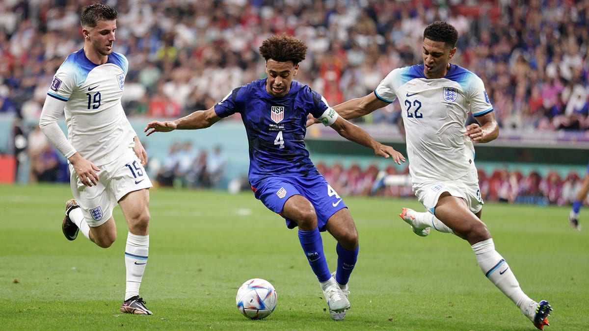 Tyler Adams fighting for ball agains England