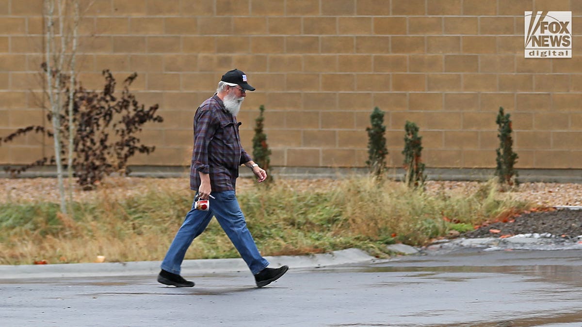 Latah County Prosecuting Attorney Bill Thompson walks into police hq