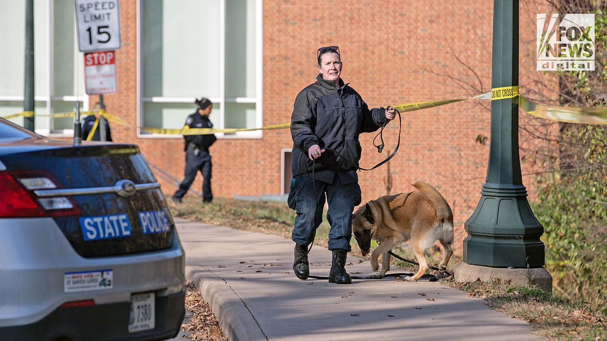 Officer walks on UVA campus after shooting