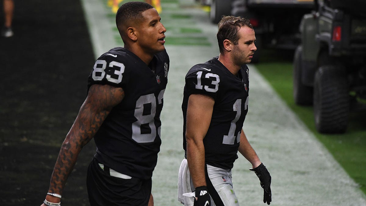 Darren Waller and Hunter Renfrow wa;king off field