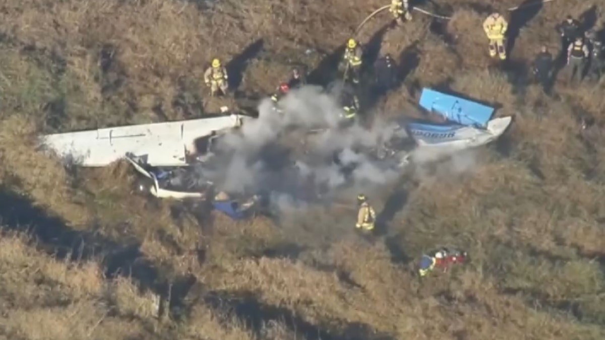 firefighters at scene of wreckage