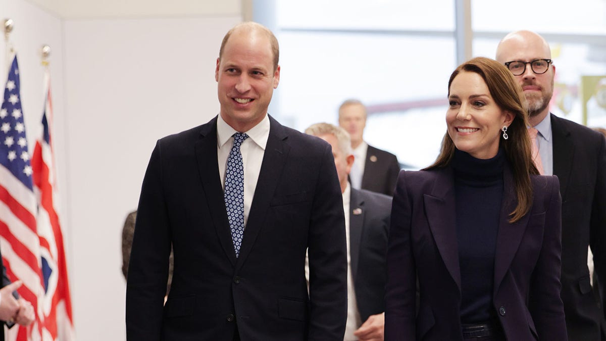 Prince William and Kate Middleton walk through the airport