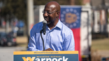 COLUMBUS, GA - OCTOBER 08: Senator Rev. Raphael Warnock speaks to supporters during his campaign tour, outside of the Liberty Theater on October 8, 2022 in Columbus, Georgia. Warnock is running for reelection against Republican candidate Herschel Walker (Photo by Megan Varner/Getty Images)