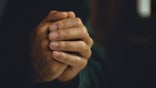 Man worship pray for god blessing to wishing have a better life. Man hands holding praying to god with the bible. christian life crisis prayer to god concept