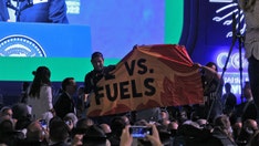 Biden interrupted by protesters at COP27 as he calls for 'transformational changes' to prevent 'climate hell'