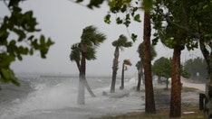 Weakened Tropical Storm Nicole batters Florida before moving up East Coast
