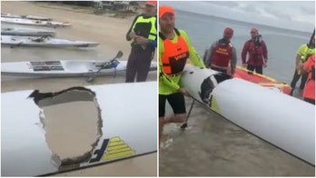 Australian teenager sent flying into the air after great white takes massive bite out of his surf ski