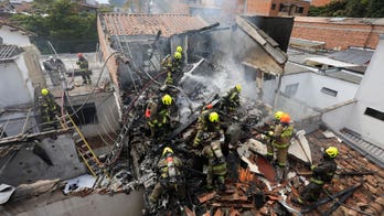 Small plane crashes in Colombian neighborhood killing 8